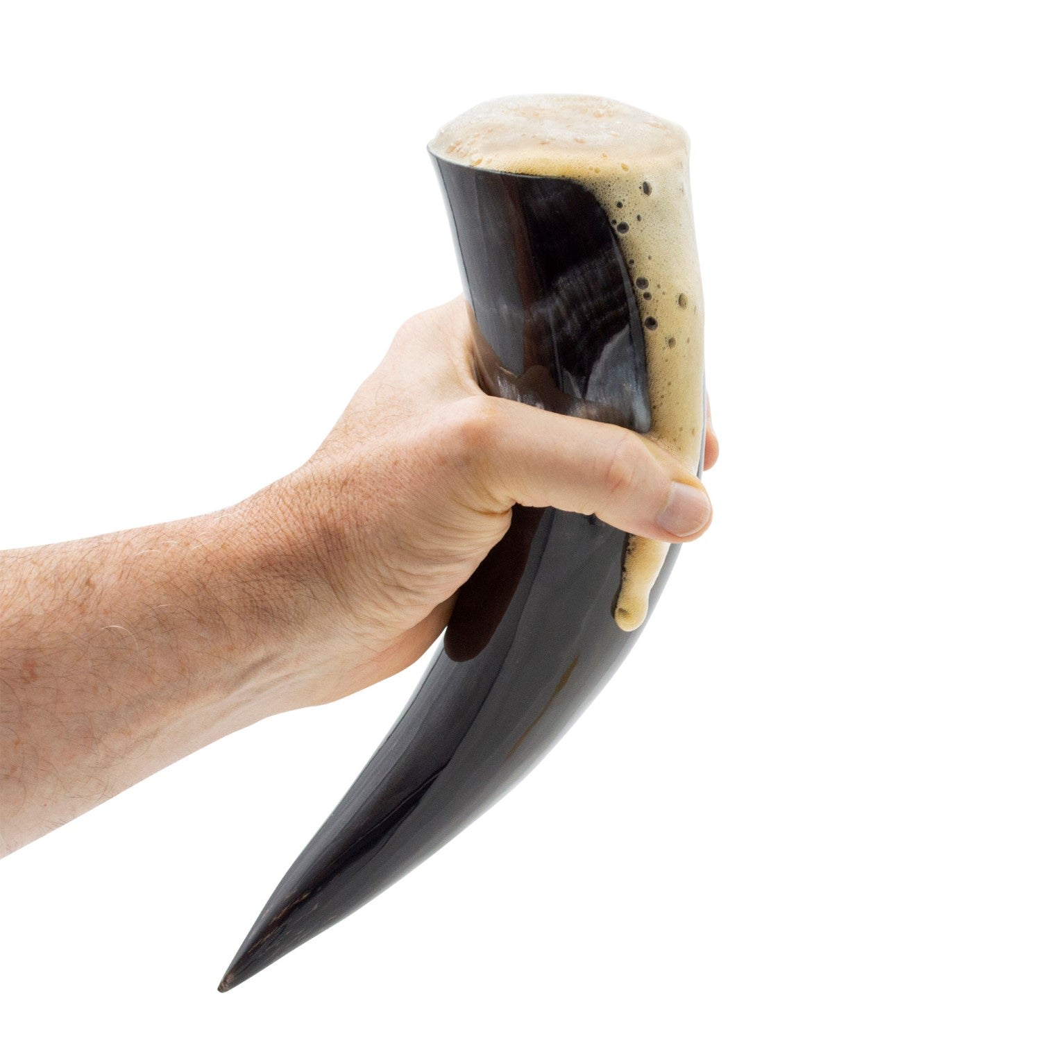 Hand holding a large black and white horn with a white background