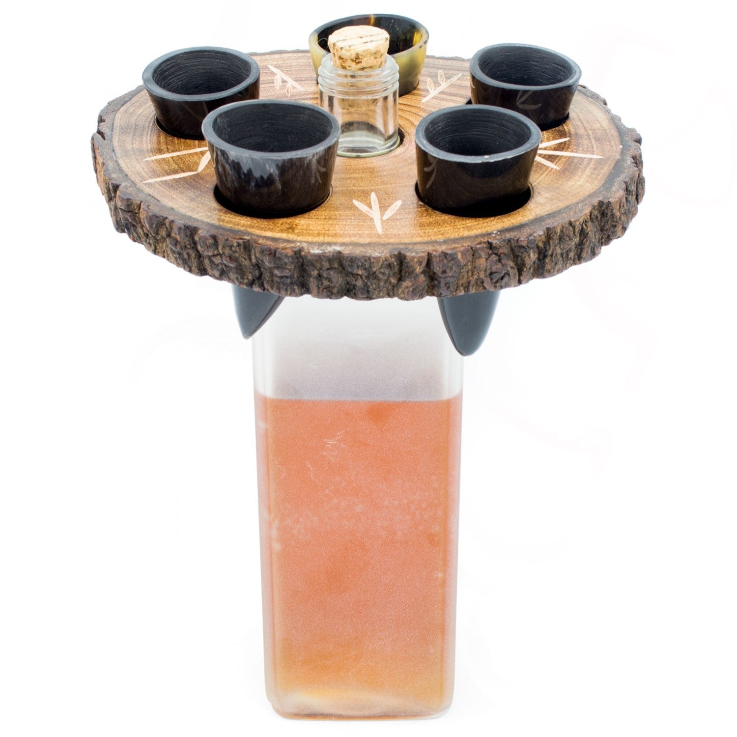 Drinking station with four black cups and a central glass container on a wooden base.
