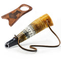 Wooden and horn hunting call with leather strap on a white background