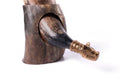 Wooden horn with a decorative gold tip on a white background