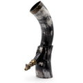 Decorative horn with gold accents on a white background