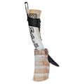 Decorative horn with black braided design on a white background