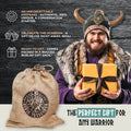 Man in Viking costume holding a gift box with text about a unique gift for warriors.