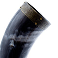 Decorative horn with Celtic knot design on a white background