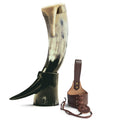 Horn with leather sheath on a white background