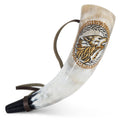 Decorative horn with a wolf design on a white background