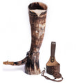 Large horn with leather holder on a white background