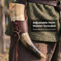 Decorative horn with leather holster on a person wearing a green jacket.
