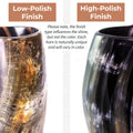 Two horn-shaped cups with low-polish and high-polish finishes on a white background.
