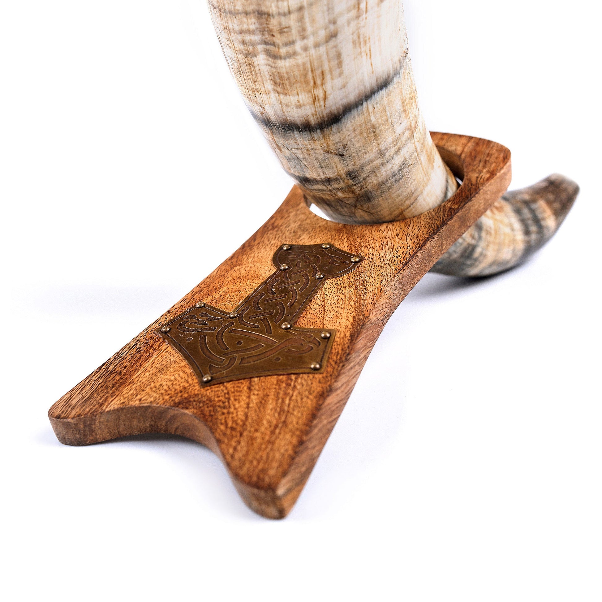 Wooden holder with a decorative emblem holding a shofar on a white background